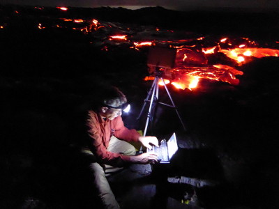 Howell using infrared camera to observe Kilauea lava flows.