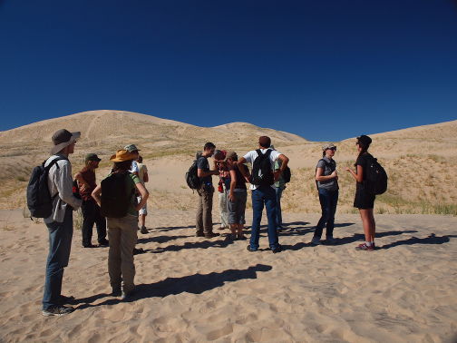 Group setting off to the large dune in the background.